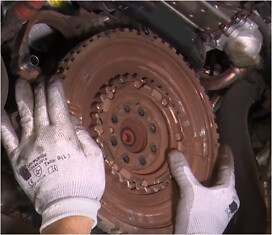 Remove the engine flywheel locking tool