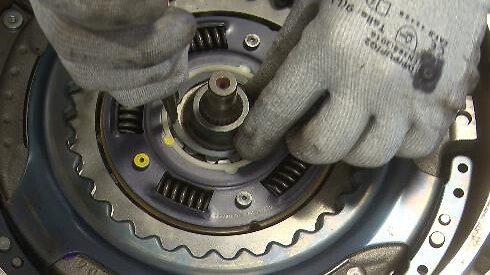 STEP 9 – Insert the outer snap ring with a pliers