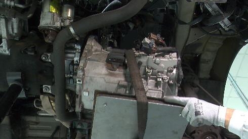 STEP 4 - Reassembly gearbox using the hydraulic lift table smoothly until DDC and flywheel are completely fitted