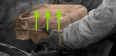 Remove the coolant reservoir by disassembling the 4 bolts.