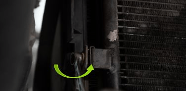 Unscrew the condenser nuts to make the radiator free.  Pull the radiator and the intercooler assembly gently.